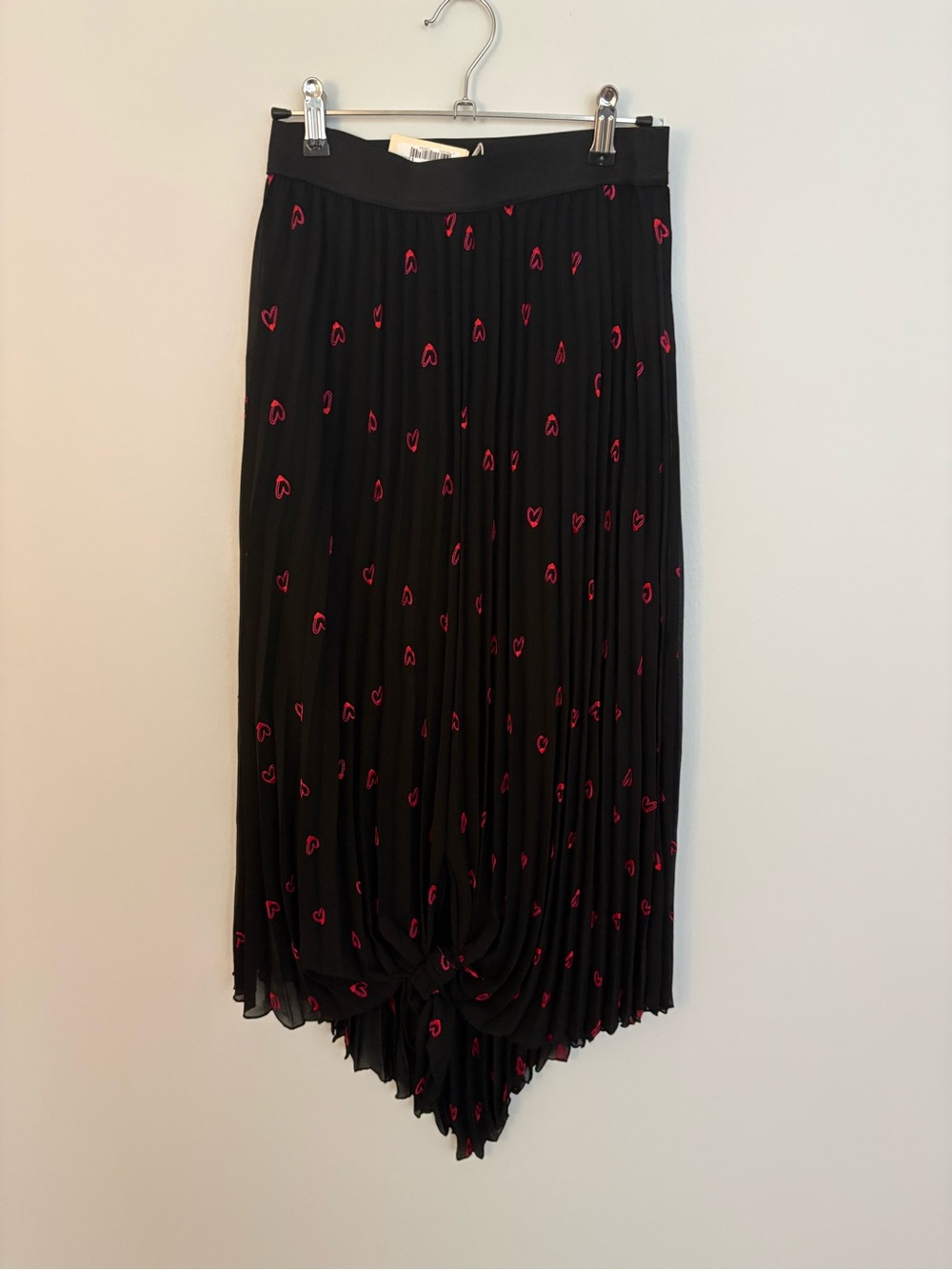 Maje Black Asymmetrical Pleated Skirt with Pink Heart Motif